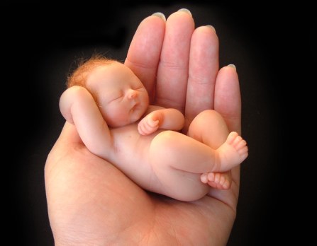 is she a giant? or is the baby just really fucking small?
